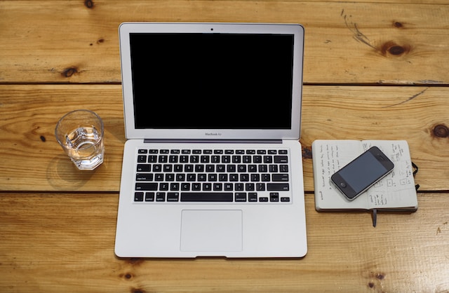 Laptop and notebook on the table